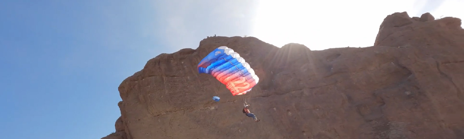 Parachute BASE jump off a cliff in Arizona