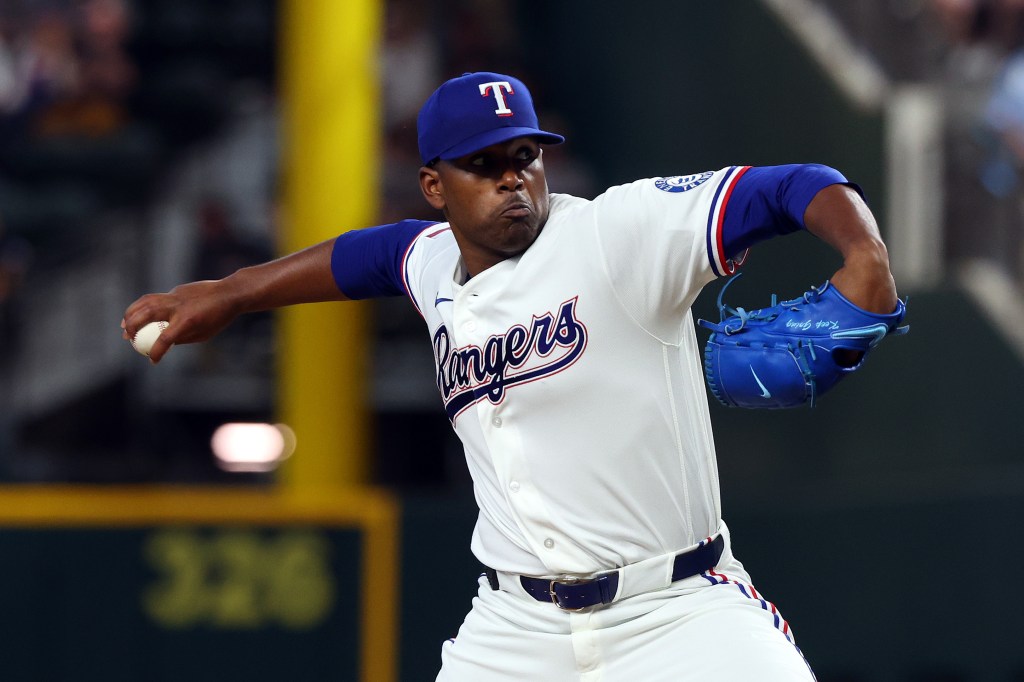 ARLINGTON, TEXAS - APRIL 04: Kumar Rocker #80 of the Texas Rangers delivers a pitch against the Cincinnati Reds in the first inning at Globe Life Field on April 04, 2026 in Arlington, Texas. (Photo by Richard Rodriguez/Getty Images)