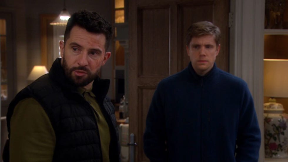emmerdale ross barton robert sugden two men standing in a home entrance