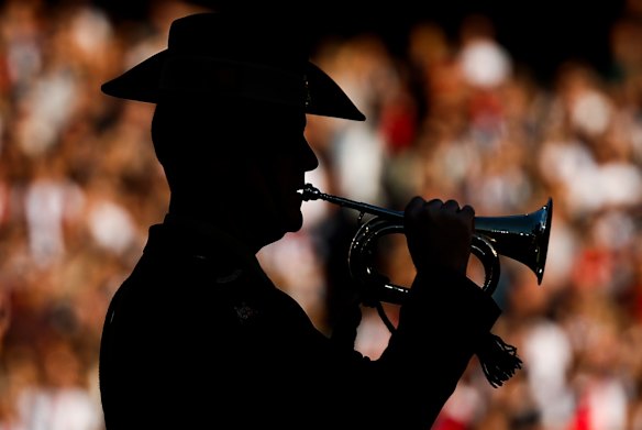 The Last Post is played by the bugler at the MCG.