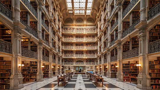 The Peabody Stack Room is a great sky-lit atrium constructed around five tiers of cast-iron balconies.