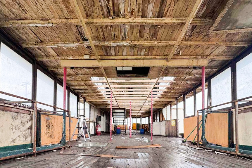 The empty internal rooms of a timber boat