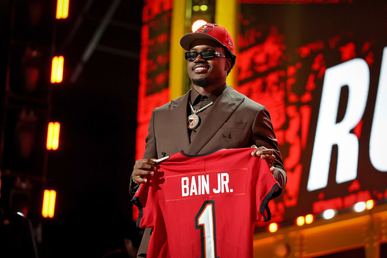 Rueben Bain Jr. of Miami celebrates after being selected fifteenth overall pick by the Tampa Bay Buccaneers in the first round of the NFL Draft at Acrisure Stadium on April 23, 2026 in Pittsburgh.