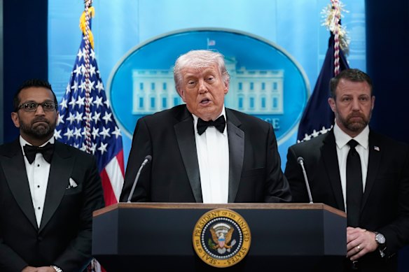 President Donald Trump speaks at the White House, flanked by FBI director Kash Patel and Homeland Security Secretary Markwayne Mullin.