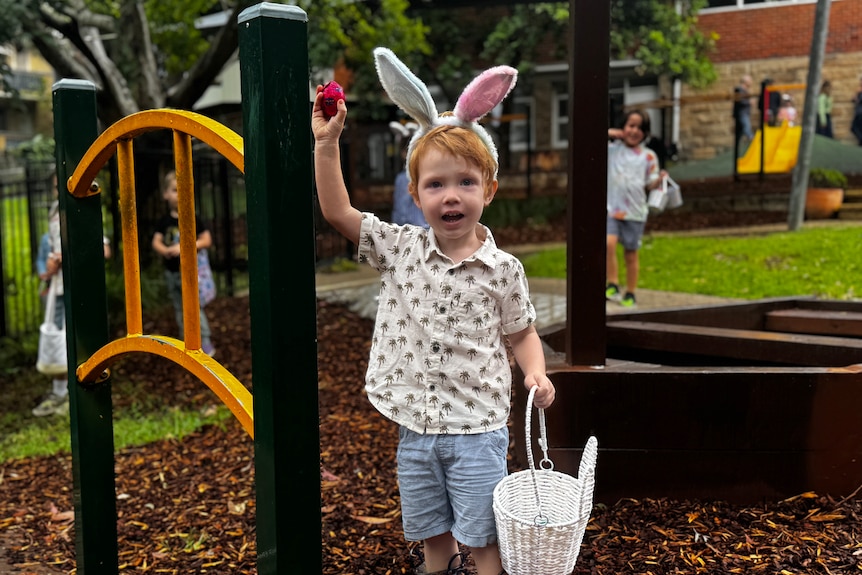 A child holding an Easter egg.