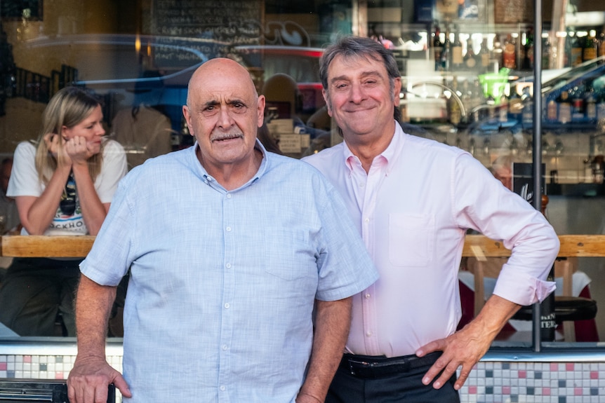 The two Marios pictured outside the cafe in recent times.