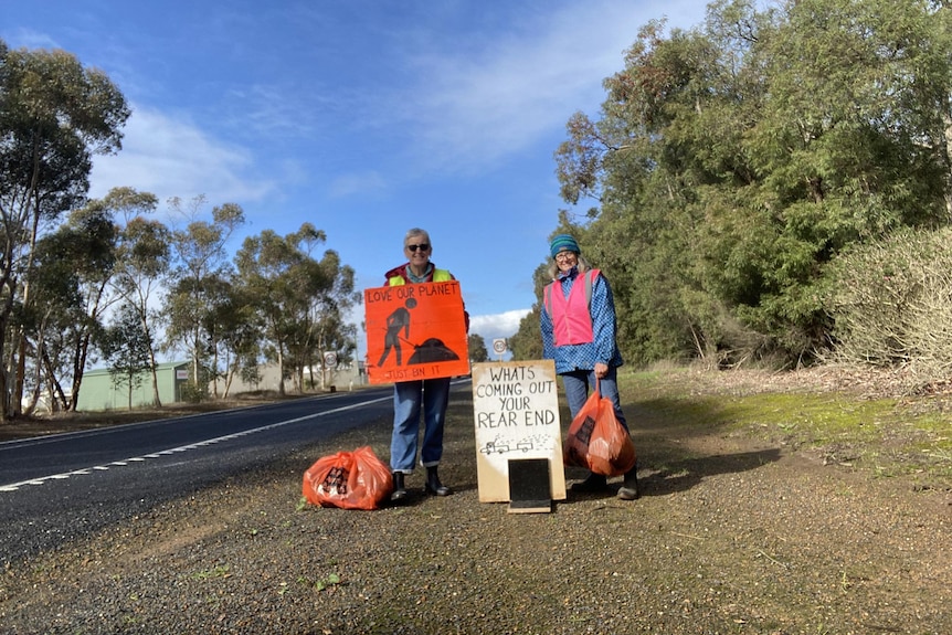 Two women with signs