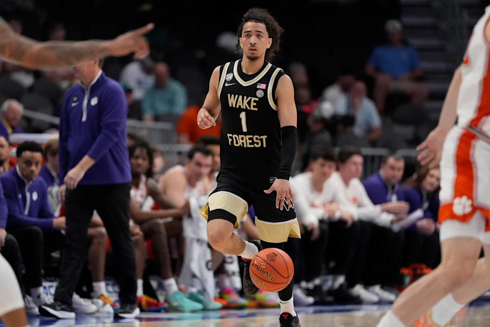 Mar 11, 2026; Charlotte, NC, USA; Wake Forest Demon Deacons guard Nate Calmese (1) brings the ball up court during the second half against the Clemson Tigers at Spectrum Center. Mandatory Credit: Jim Dedmon-Imagn Images