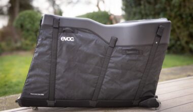 A black bike box standing in a garden