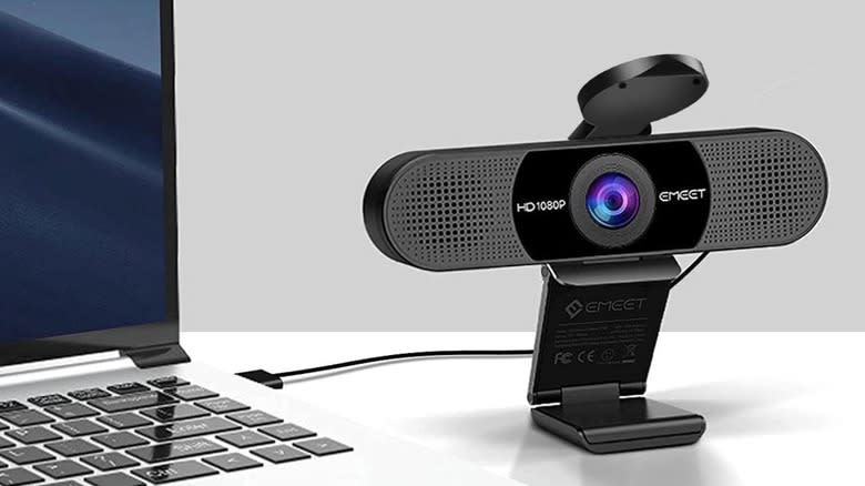 An Emeet webcam plugged into a laptop.