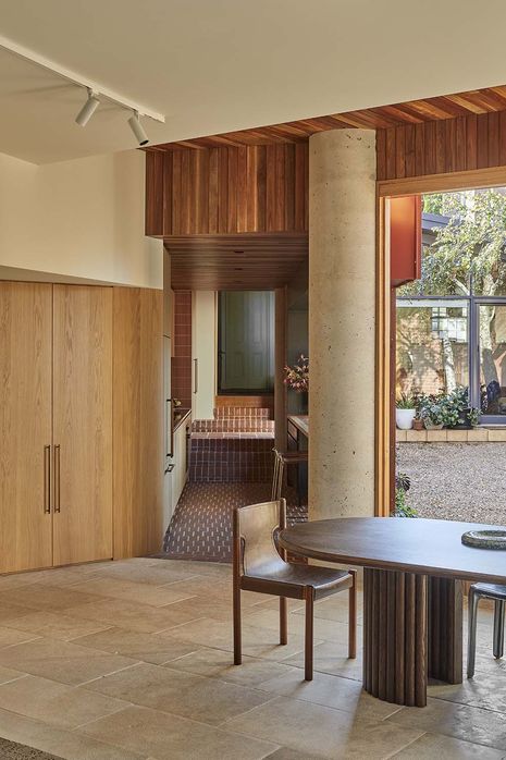 The addition hugs the rear site boundaries, leaving the existing terrace largely unaltered.