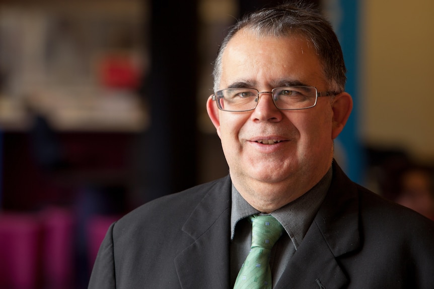 A middle aged man with glasses.