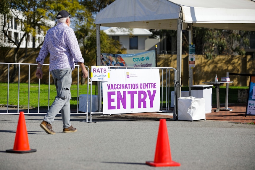 A man enters a vaccination centre in Perth.