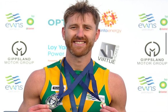 Former Essendon footballer Dyson Heppell displays his Stan Aitken Medal and AFL best-on-ground medal after winning the Gippsland League grand final with his hometown club the Leongatha Parrots.