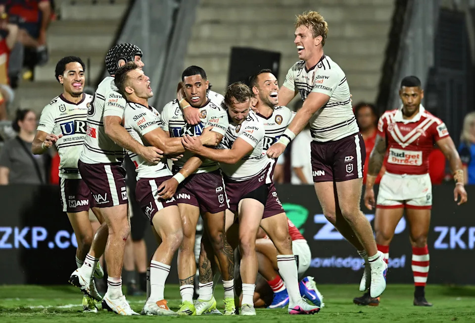 Tolutau Koula celebrates a try.