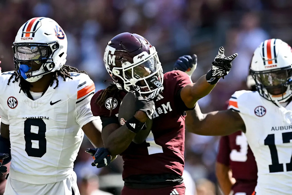 Sep 27, 2025; College Station, Texas, USA; Texas A&M Aggies wide receiver Mario Craver (1) motions against the Auburn Tigers during the first half at Kyle Field. Mandatory Credit: Maria Lysaker-Imagn Images