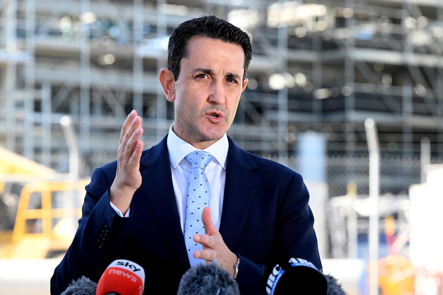 A man in a suit in an industrial setting