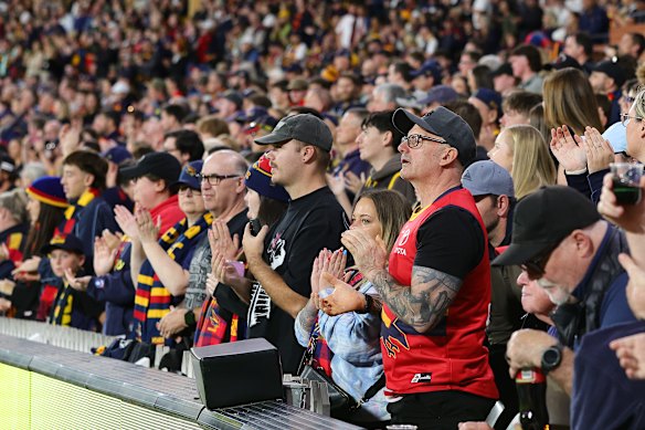 Fans pause to pay their respects to the Dawson family.