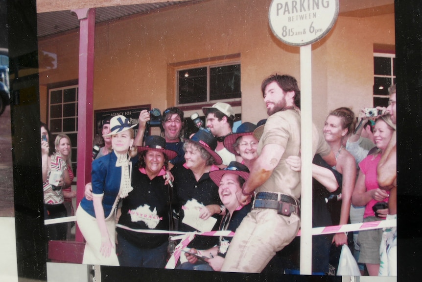 Actors Nicole Kidman and Hugh Jackman pose with a group of fans