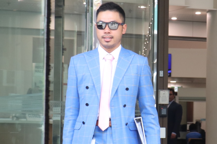 Prosecutor Ronald Nguyen leaves a court building. 