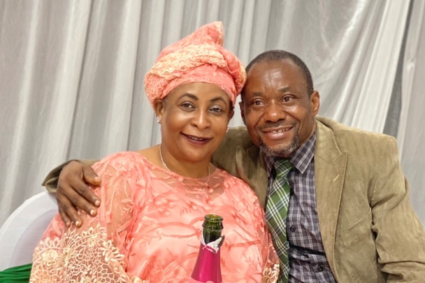 Roza Abebwa smiling next to a man.