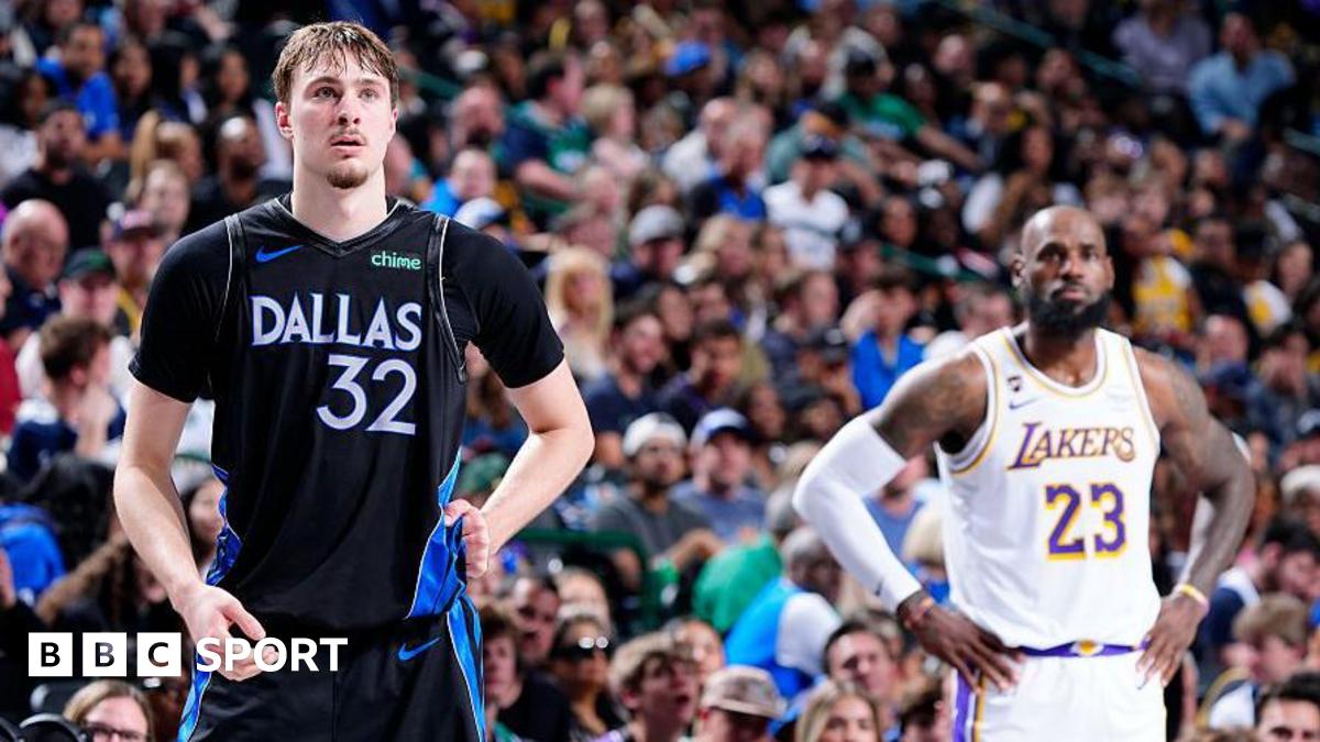 Cooper Flagg and LeBron James stand next to each other on court