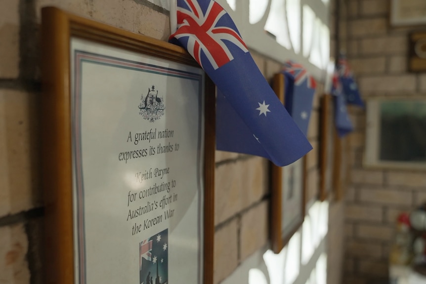 A sign on Keith Payne's house, saying a grateful nation thanks him. 