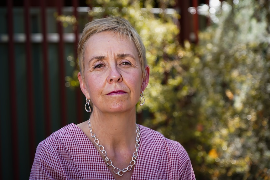 Micaela Cronin the Domestic, Family and Sexual Violence Commissioner stands outdoors looking at the camera