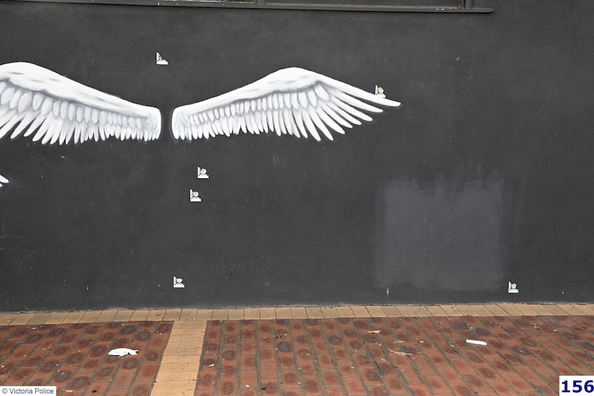 Damage to the walls of the Sweet Lulu's cafe, marked by police investigating Gavin Preston's death.