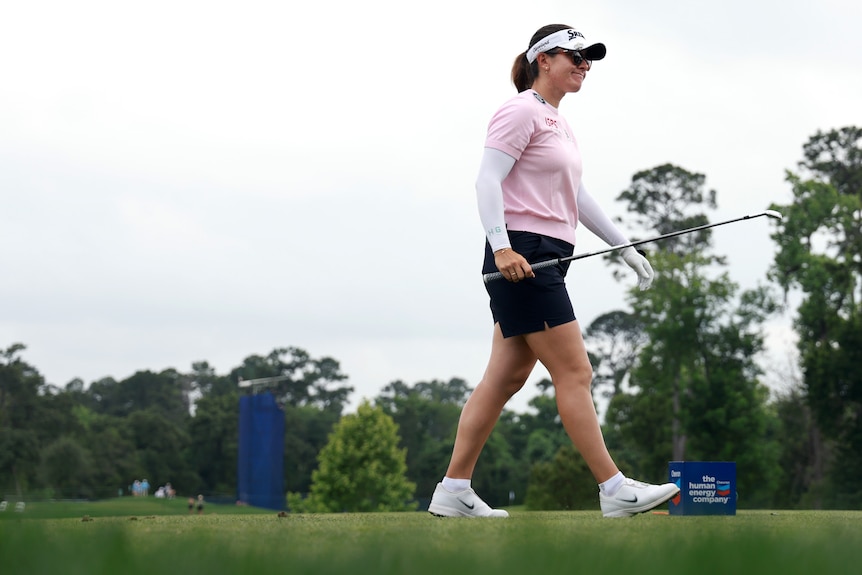 Golfer Hannah Green walks on the course at the Chevron Championship golf tournament.