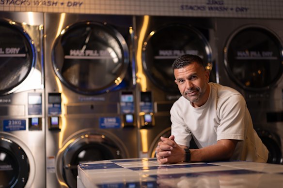 Omer Tas, founder of Sydney laundromat chain Stacks Laundry, in the Harris Park store.