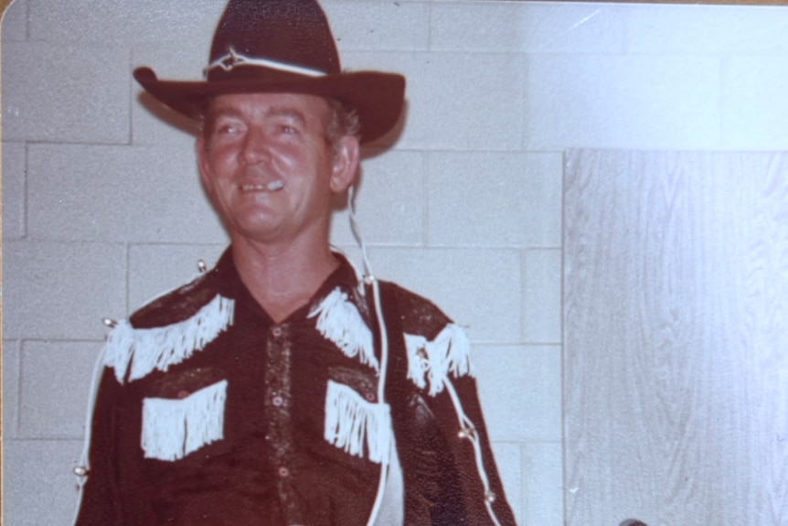 An old picture from 1966 of a man dressed as a cowboy.