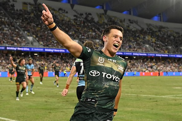 Cowboys’ Scott Drinkwater celebrates the try of teammate Murray Taulagi during the round eight NRL match against the Cronulla Sharks.