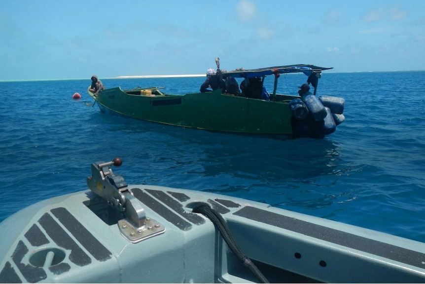 A small boat in the ocean.