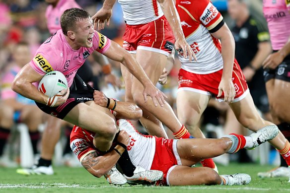 Mitch Kenny goes down after a hip-drop tackle by Dolphins five-eighth Kodi Nikorima.