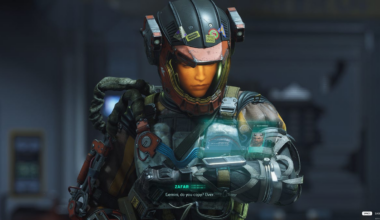 A woman in a space suit answers a call on her wrist-mounted holographic display.