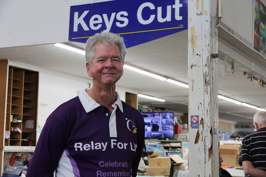 Alan Potty smiling at the camera at the keys cutting section of hardware store