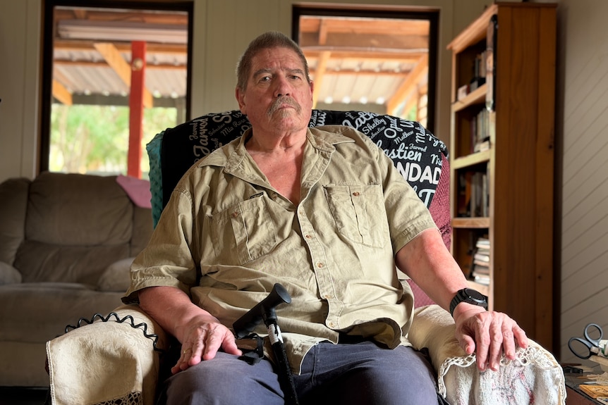 A man sitting on a sofa.