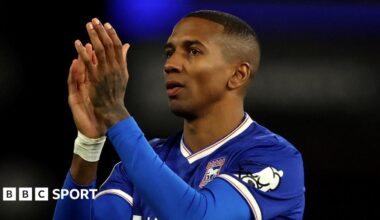 Former England defender Ashley Young in a blue Ipswich Town shirt, clapping his hands