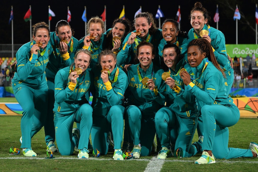 Australia with its gold medals after winning the women's rugby 7s competition at the 2016 Rio Olympics.