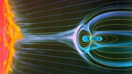 Sketch of the interaction between the solar wind and a magnetized planet. The sun on the left hand side appears to be shooting out rays that are bending in patterns around a smaller planet on the right.