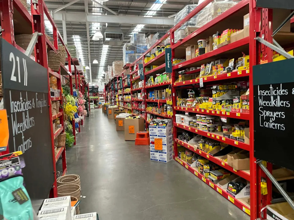 A Bunnings aisle showing pesticides on the shelves.