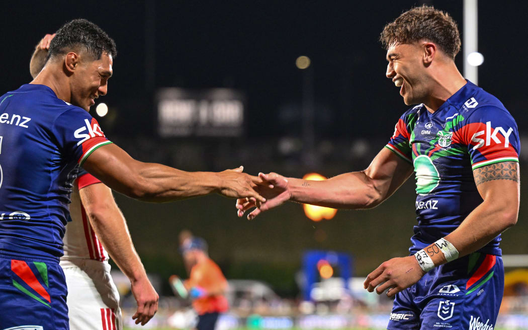 Chanel Harris-Tavita of the Warriors celebrates his try with Roger Tuivasa-Sheck of the Warriors, NZ Warriors v Sydney Roosters, round 1 NRL Telstra Premiership rugby league match at Go Media Stadium.