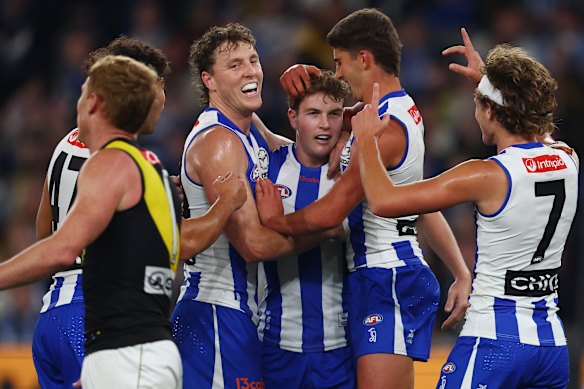 Winning confidence: The Kangaroos celebrate with Tom Powell after a goal.