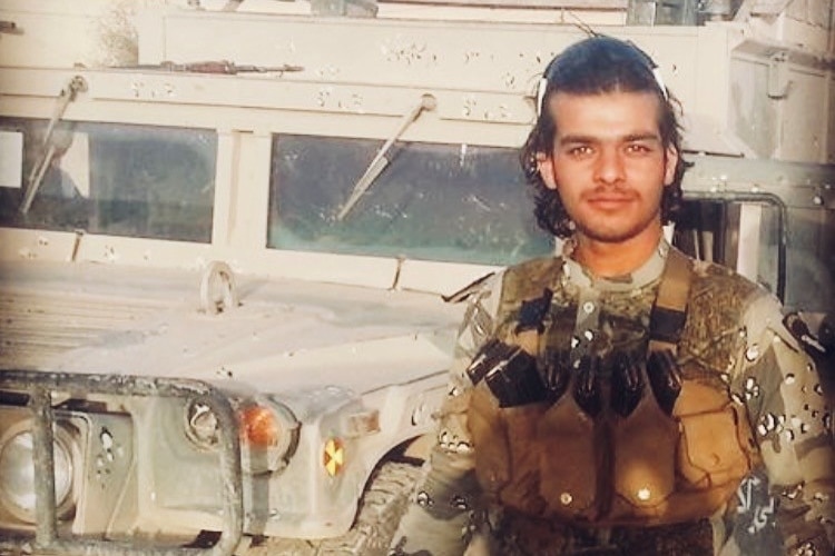 A man in a camoflauge unform.