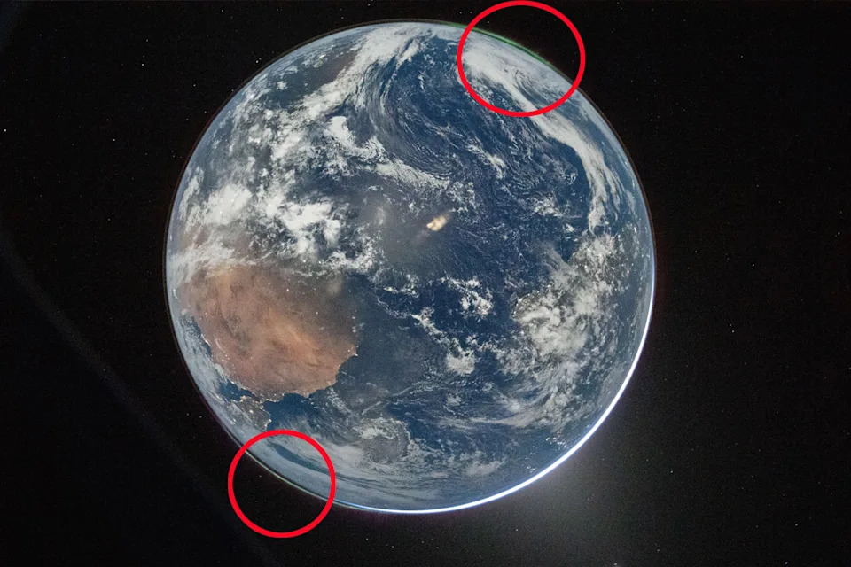 NASA astronaut and Artemis II Commander Reid Wiseman took this picture of Earth from the Orion spacecraft's window on April 2, 2026, after completing the translunar injection burn.