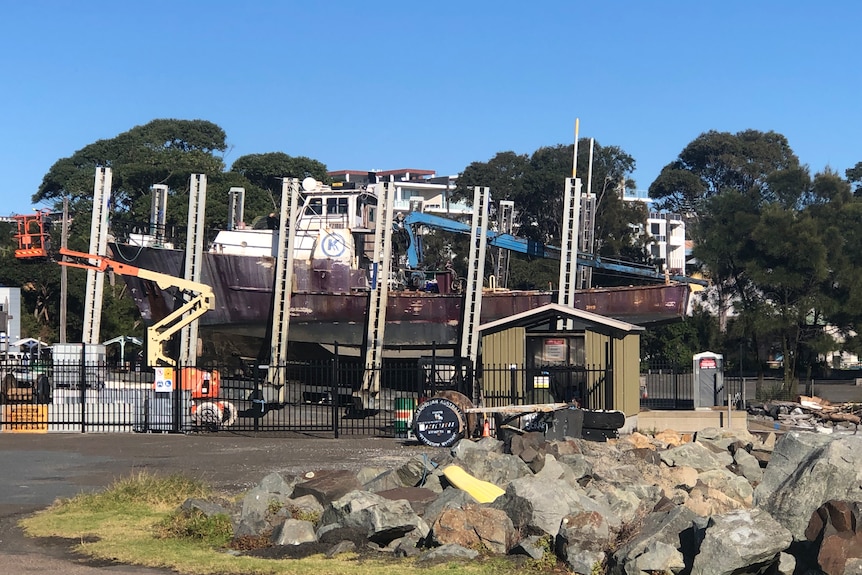 A fishing trawler out of the water