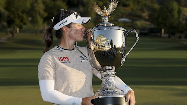 Hannah Green poses with the trophy.