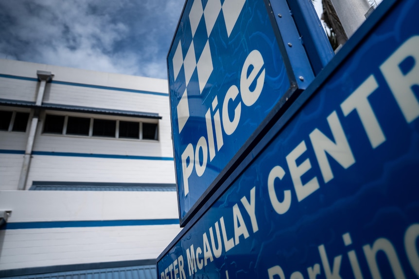 A police sign outside a building.