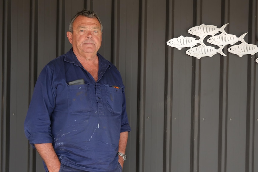 man standing in front of wall